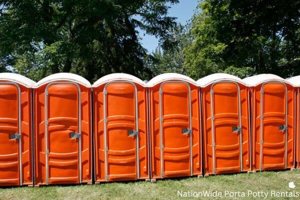 a lineup of clean and well-maintained portable loos for workers in Dubberly, LA